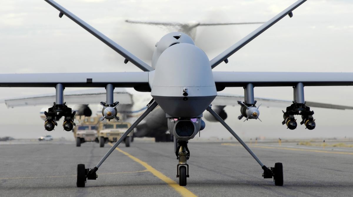 A fully armed MQ-9 Reaper taxis down an Afghanistan runway