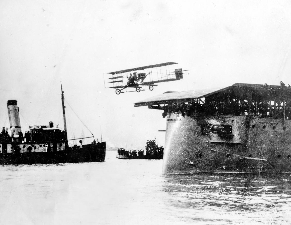 Eugene B. Ely flies his Curtiss pusher biplane off USS Pennsylvania (Armored Cruiser # 4) to return to land, 18 January 1911