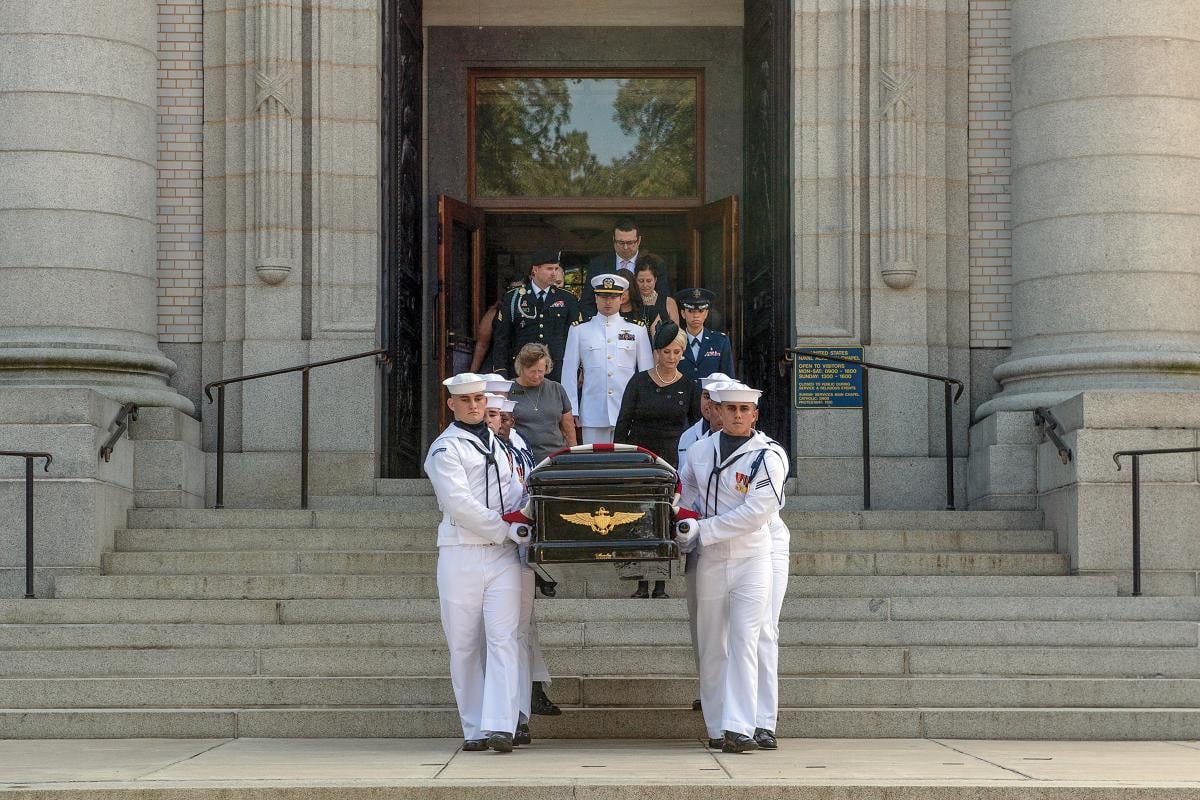 Pallbearers carry Senator McCain’s remains to their final resting place at the U.S. Naval Academy Cemetery.