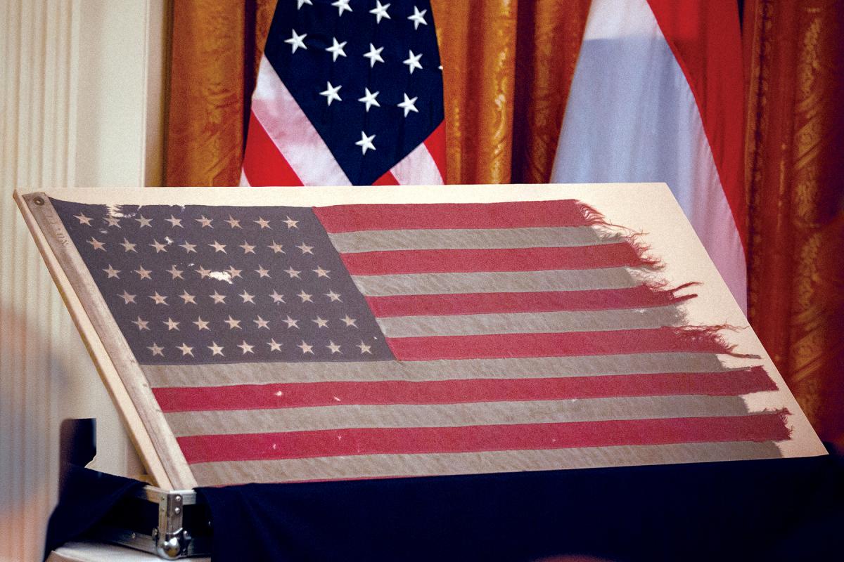 Flag of the LCC-60 on display in the White House