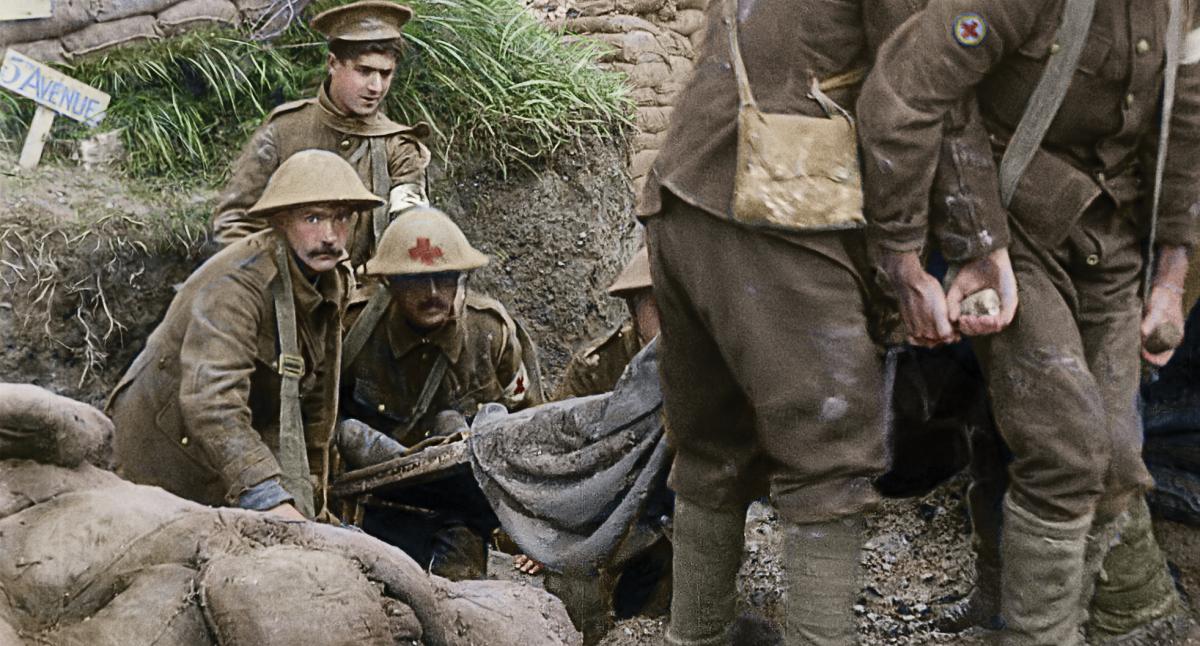 British medics carrying a wounded soldier on a litter in World War I