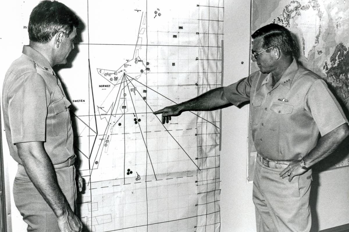 Vice Admiral “Hammerin’ Hank” Mustin discussing the details of a Second Fleet exercise with Captain Frank Lugo