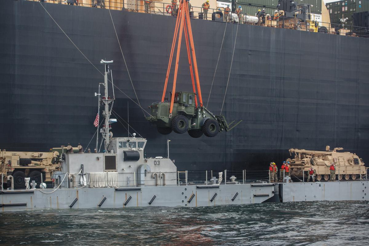 Sailors assigned to Navy Cargo Handling Battalion (NCHB) 1 offload tanks during exercise Saber Strike 17 in Ventspils, Latvia