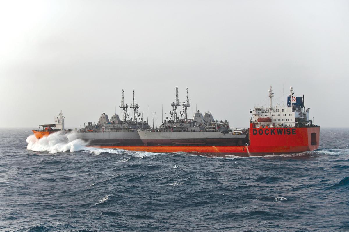 The Military Sealift Command chartered M/V Tern, a Netherlands-flagged float-on/float-off ship, transits the Indian Ocean while carrying four Avenger-class mine counter measure ships to their new homeport in Manama, Bahrain