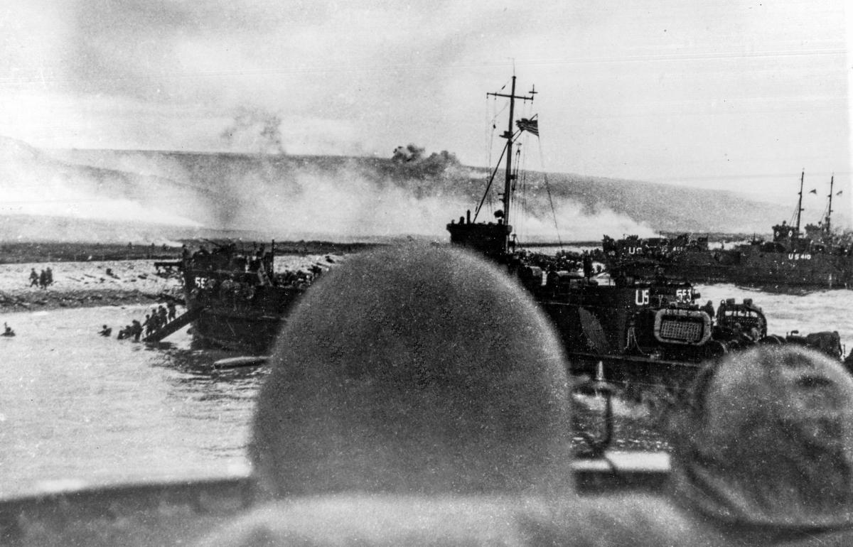 USS LCI(L)-553 and USS LCI(L)-410 land troops on "Omaha" Beach, during the initial assault there on "D-Day", 6 June 1944