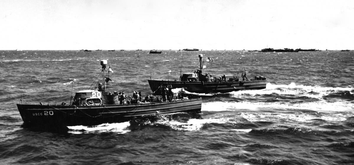 Two of the flotilla’s cutters speed toward a rescue off Normandy on D-Day