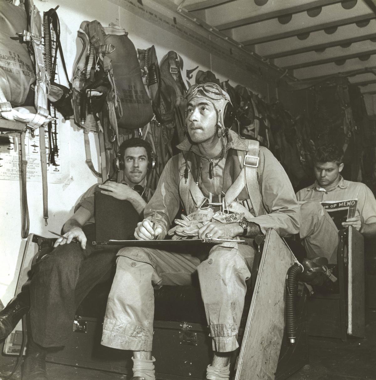 Lieutenant Commander R. Emmett  Riera seated in a ready room on board USS Hornet (CV-12)
