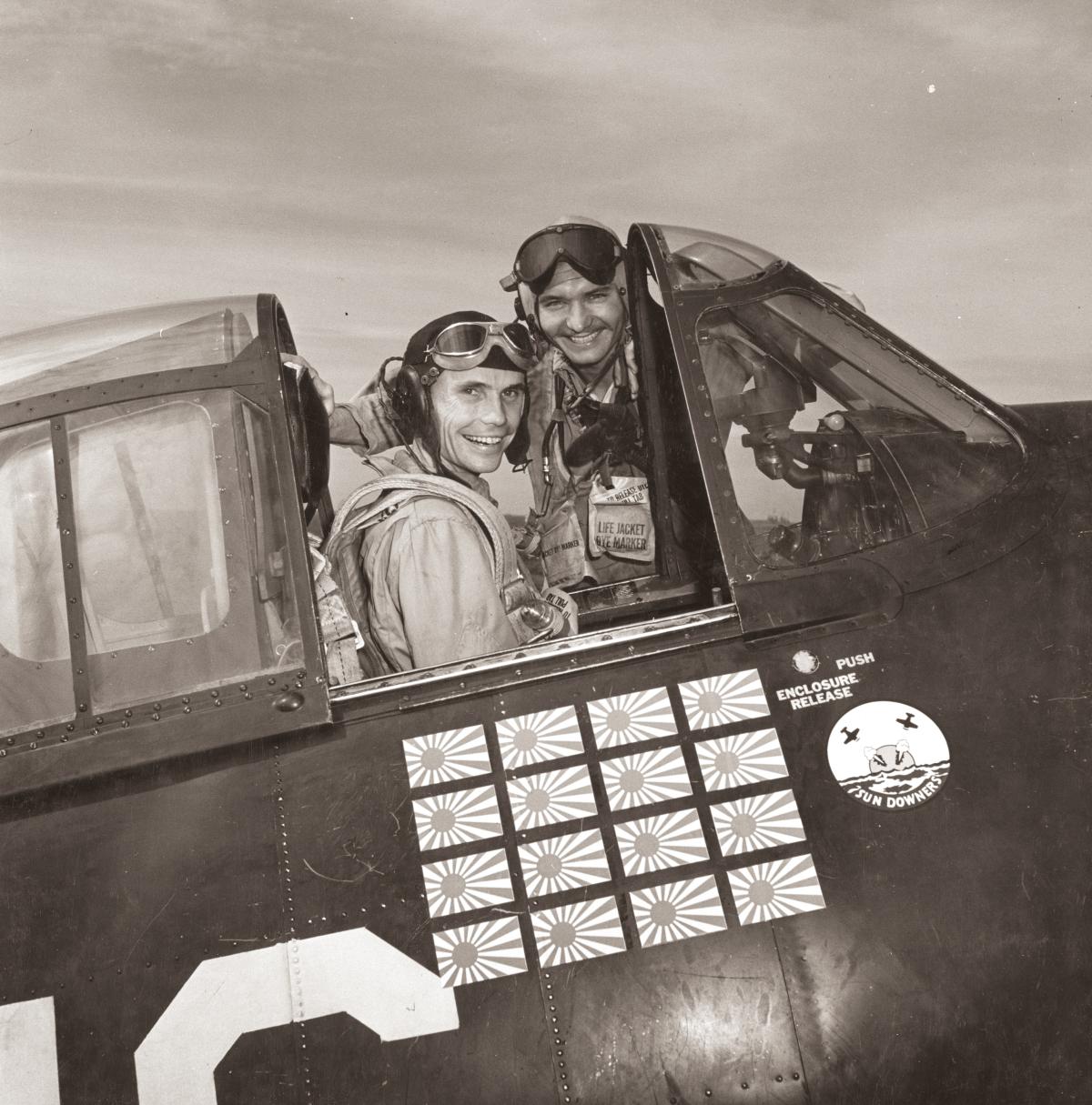Lieutenants Charlie Stimpson and Jim Swope by a Navy aircraft