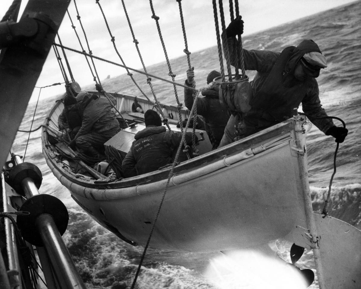 Survivors on board the Fort Mercer rescued by rafts and surfboats from the cutter Yakutat (WAVP-380)