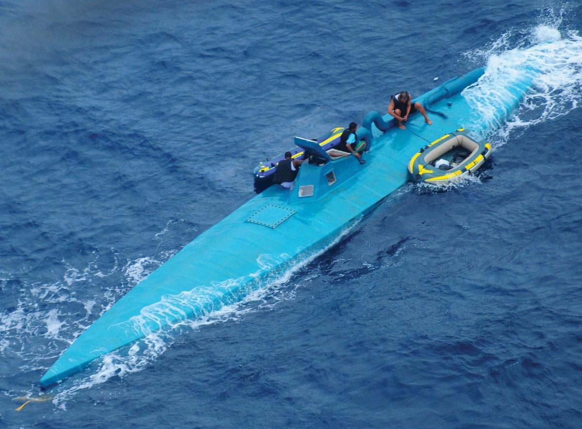 Turner&Garza-PRO-11-19 2 Crew of a semi-submersible drug trafficking vessel preparing to abandon their boat before being intercepted and detained by the Coast Guard