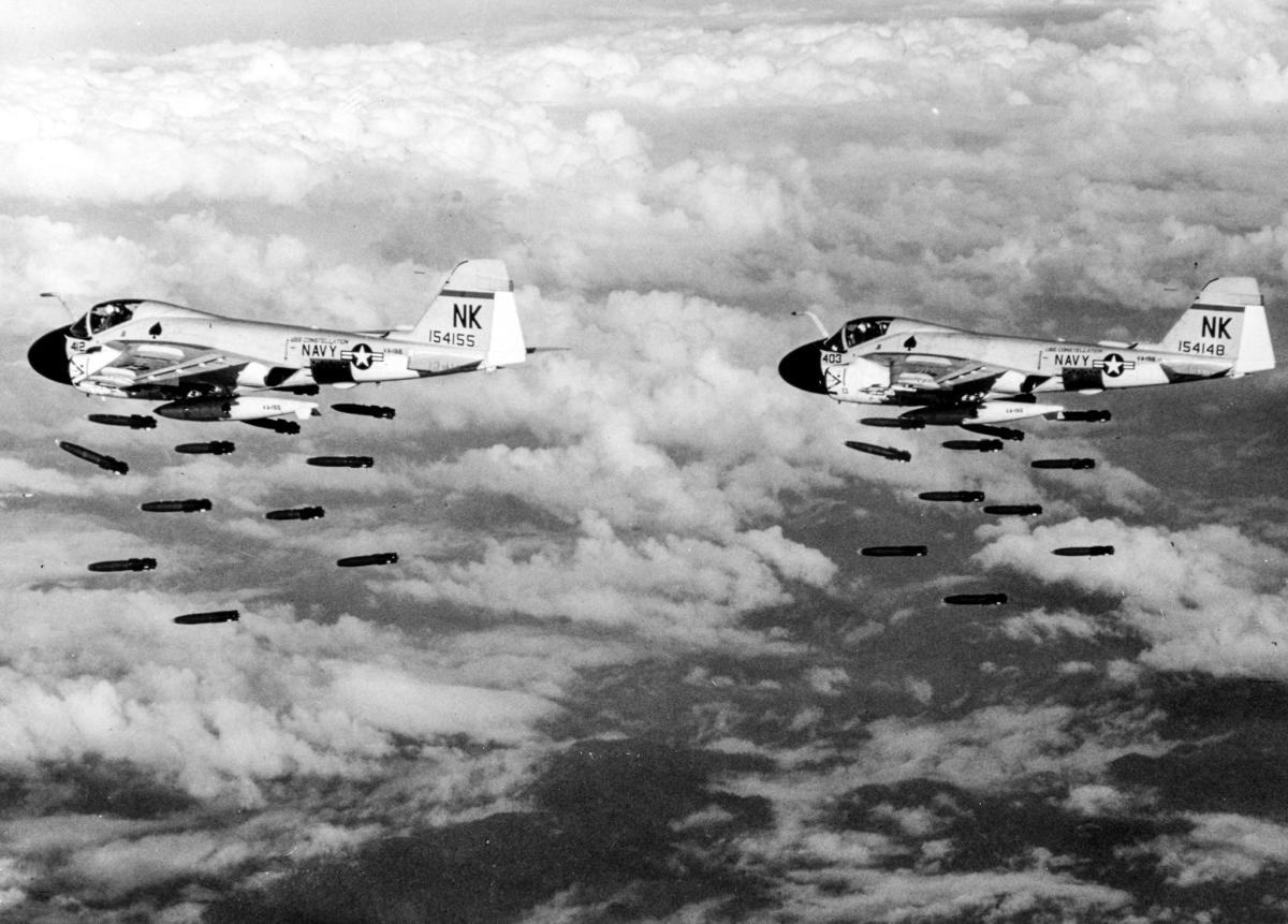 Two A-6A Intruder aircraft from Attack Squadron 196 drop bombs on targets in North Vietnam