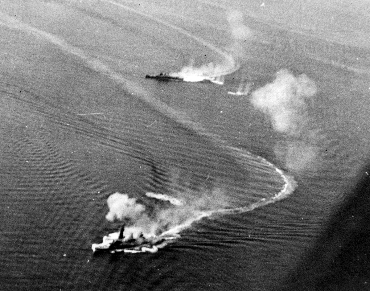 Japanese battleship and cruiser under attack during the Battle of Leyte Gulf