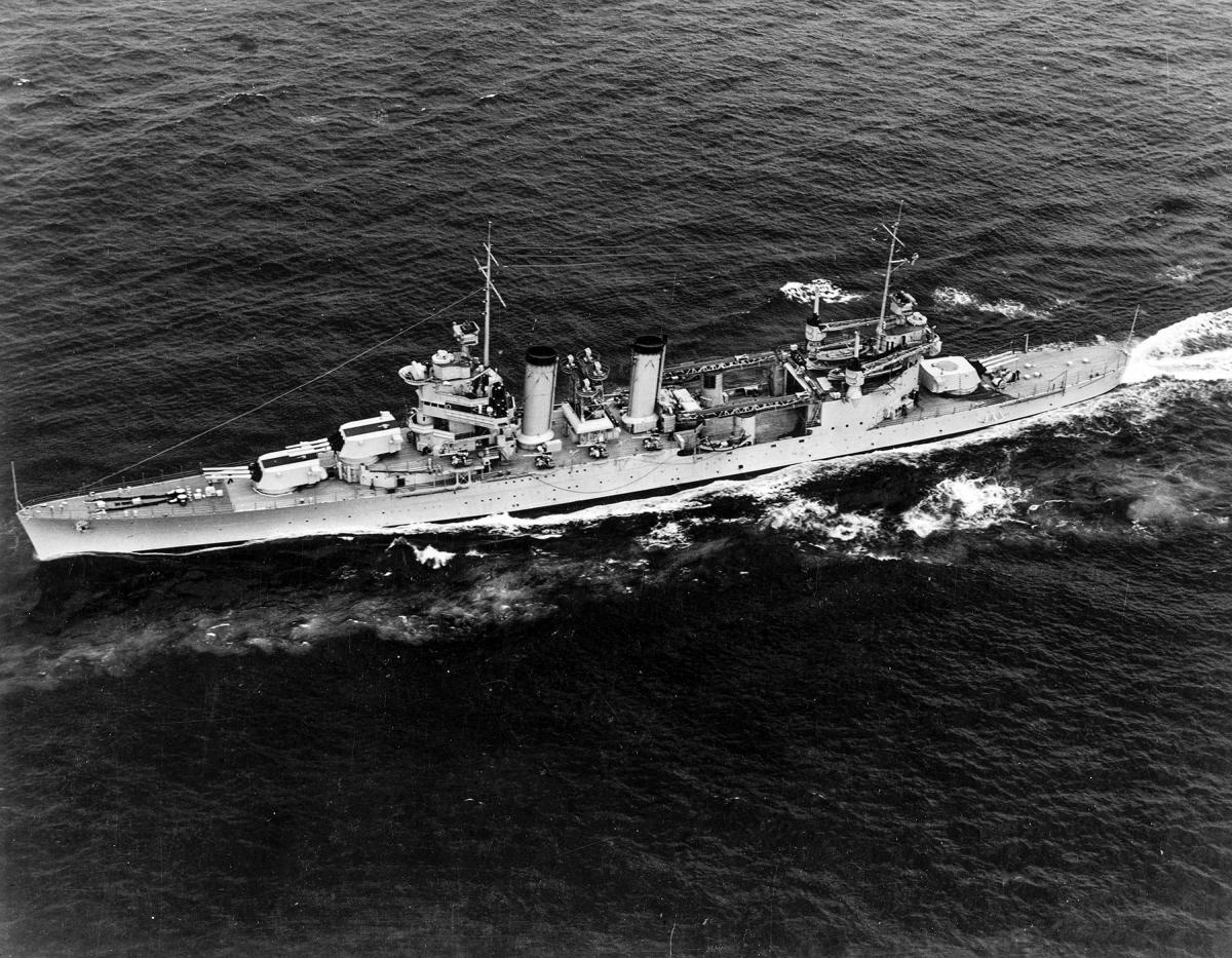 Aerial view of USS Quincy (CA-39) underway at sea.