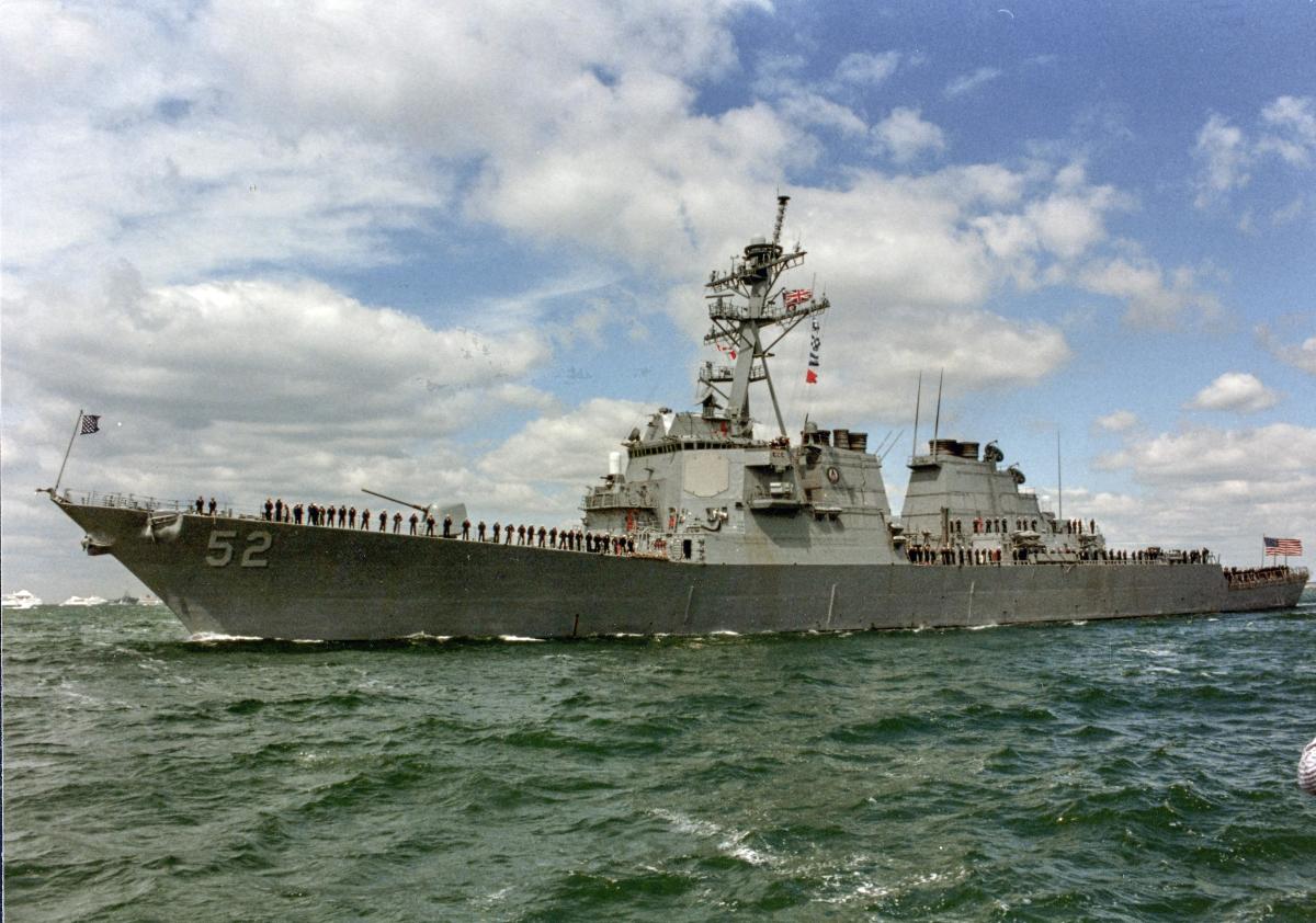 Broadside view of the USS Barry (DDG-52) with sailors manning the rails.