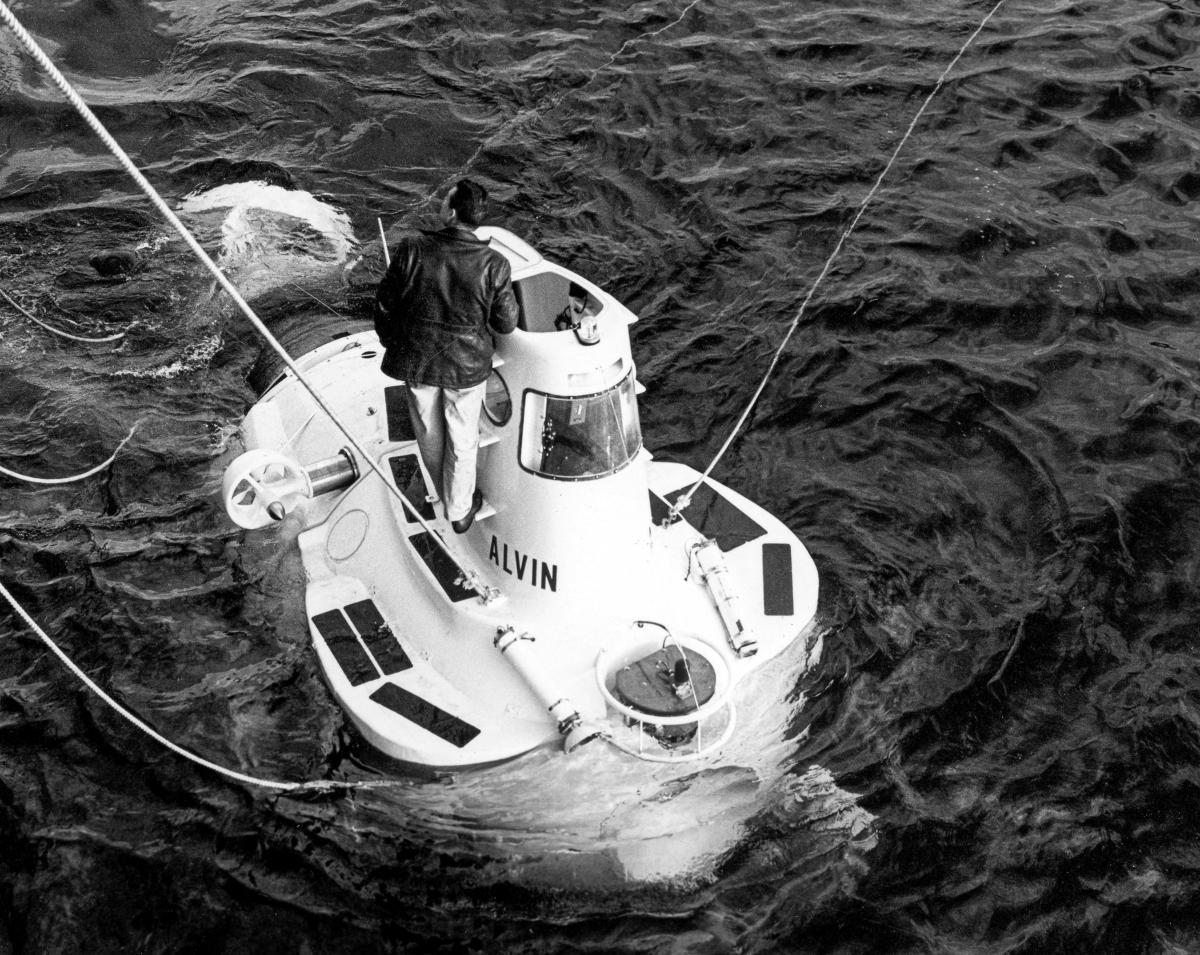 Elevated bow view of the Alvin (DSV-2) being lowered into the water to search for the missing H-bomb off the coast of Spain.