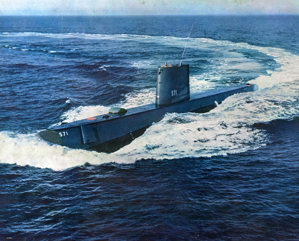Port oblique view of the USS Nautilus (SSN-571) underway in a turn