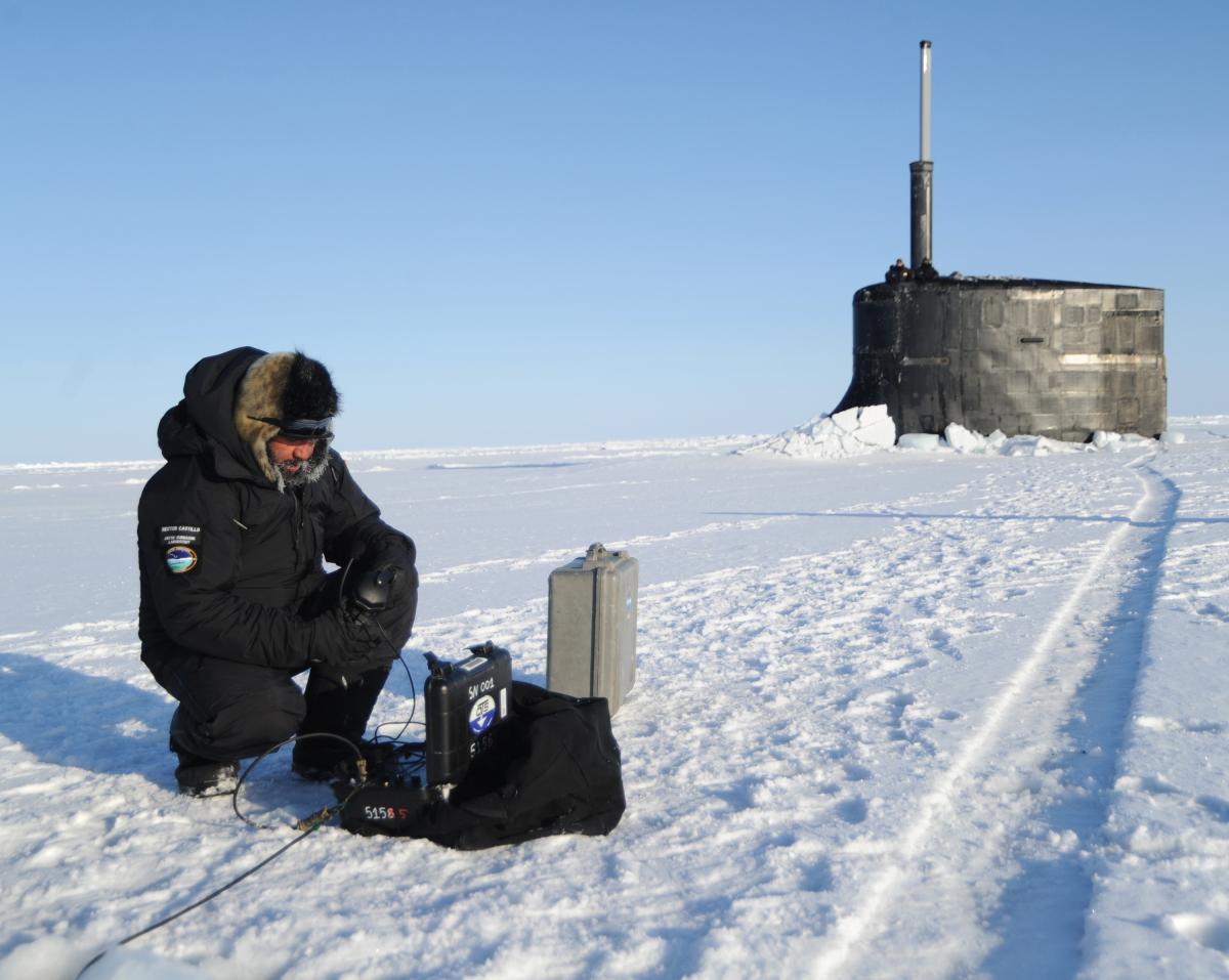 Hector Castillo, a Navy Arctic submarine laboratory technician, sets up a hydrophone to communicate with submarines prior to their surfacing through the ice during the multinational maritime Ice Exercise in the Arctic Circle in 2018