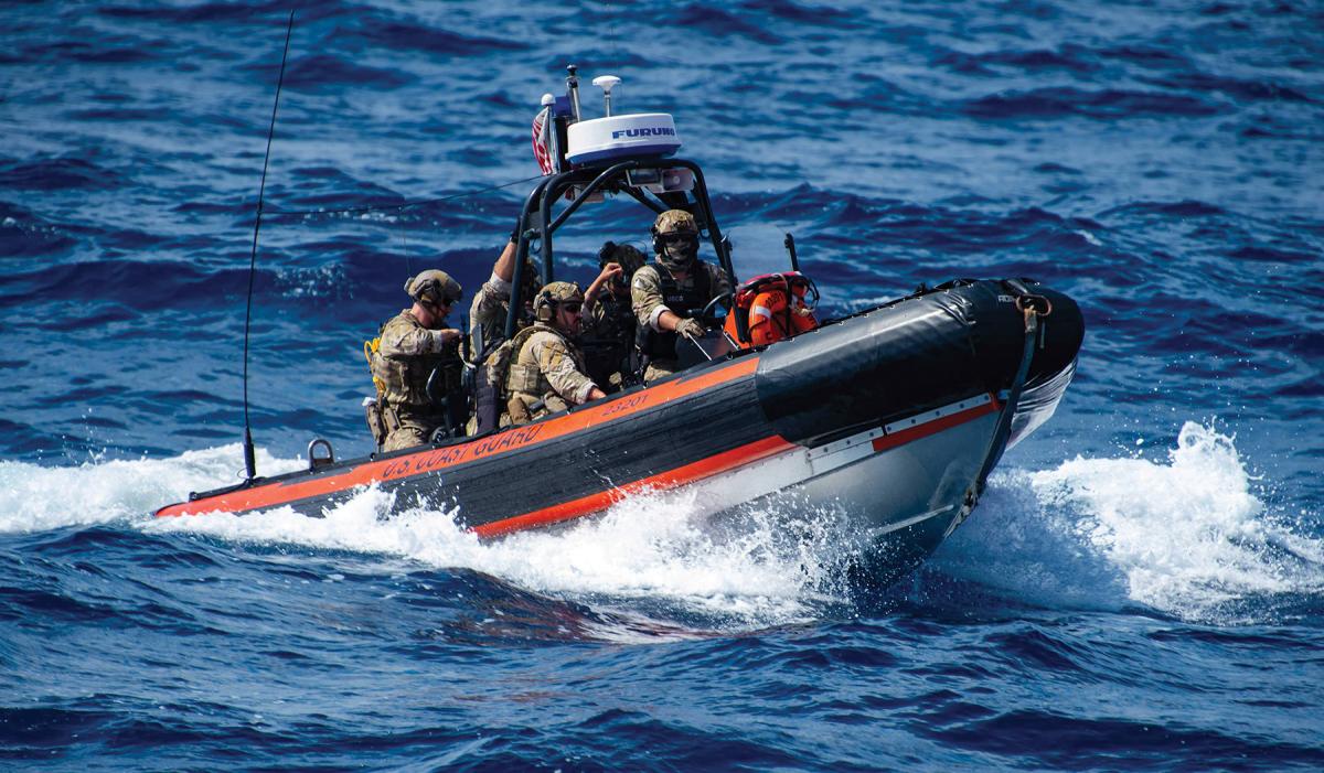  Coast Guardsmen approaching a target of interest.