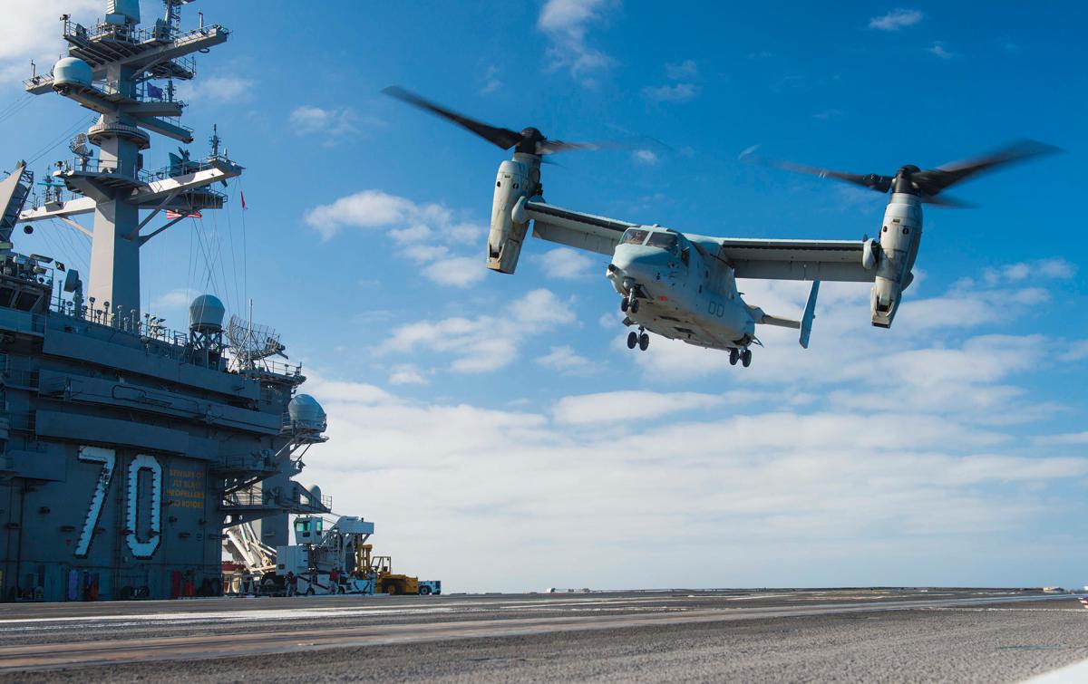 MV-22B Osprey lands on the flight deck of the carrier Carl Vinson.