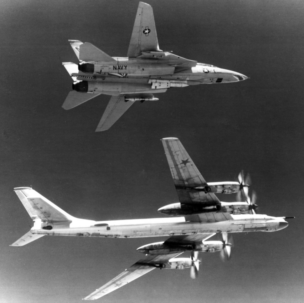 An F-14A flies on the wing of a Soviet TU-95 Bear in June 1979.