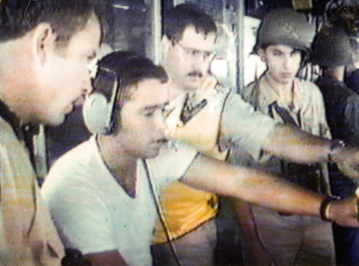 Crew of USS Vincennes (CG-49) examining air radar screen