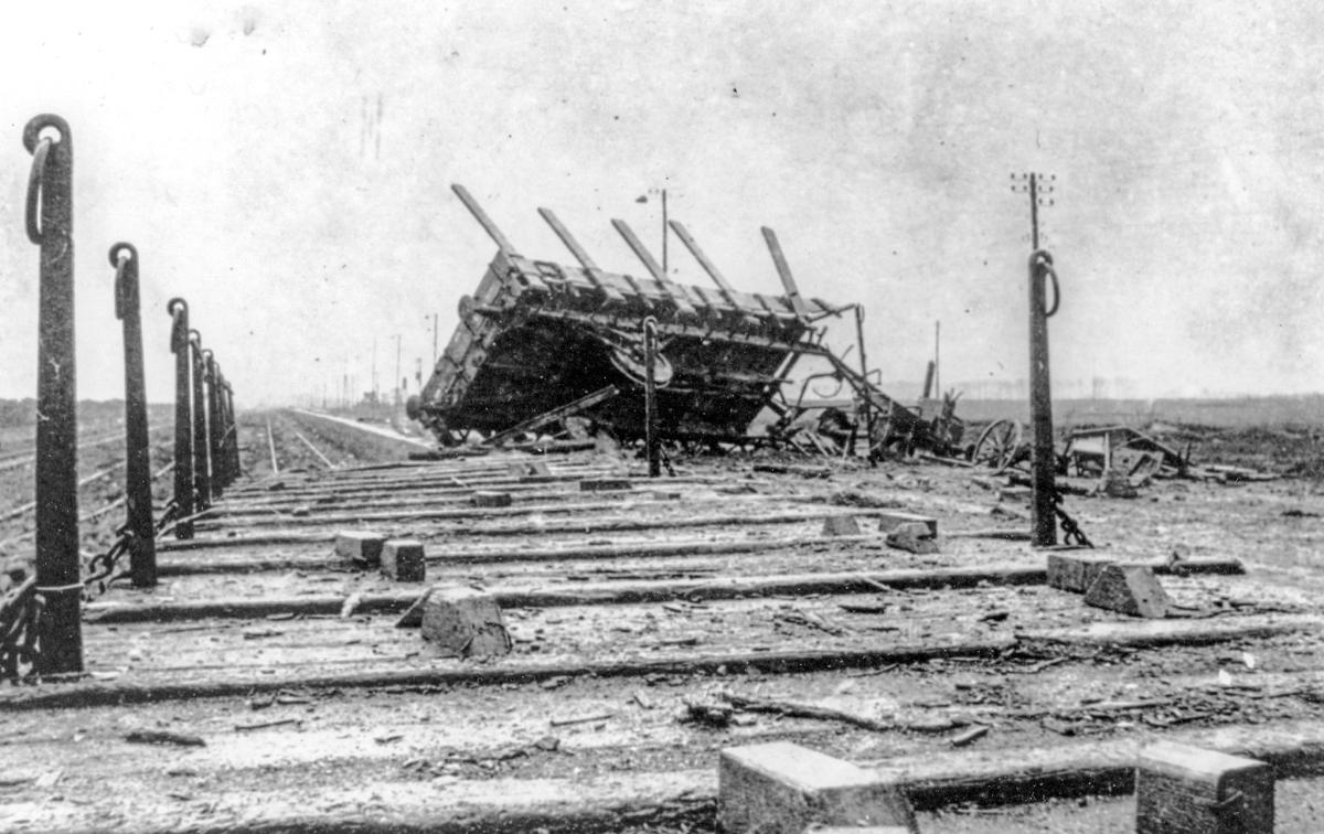 Flat car thrown on top of an adjacent car by one shot from No. 1 Gun of the U.S. Naval Railway Batteries firing at Laon, France.