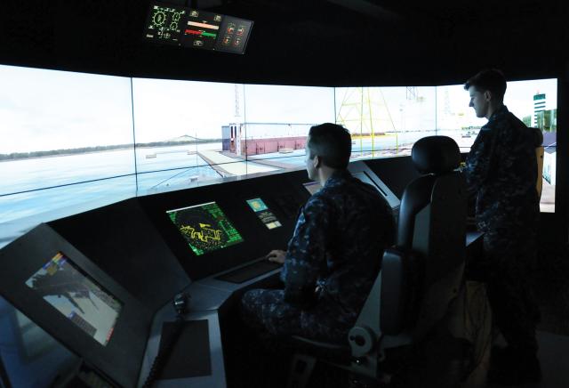 Students at Surface Warfare Officers School in Newport, Rhode Island, train on the LCS Full Mission Simulator, which has every Navy homeport modeled and allows students to navigate in and out of designated ports using the highly sophisticated controls found on board LCS bridges.