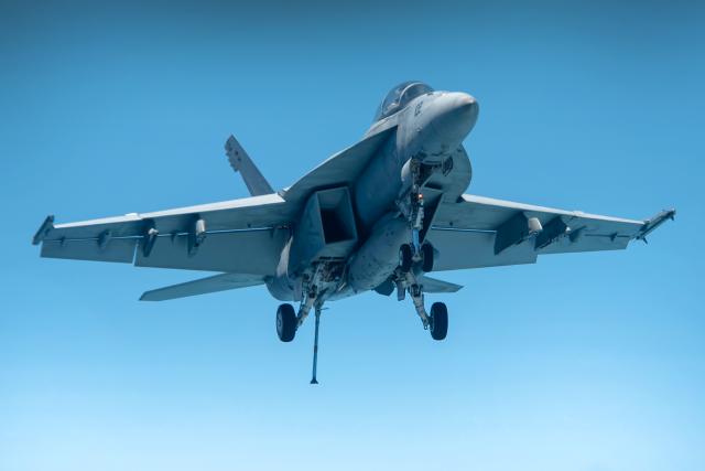 An F/A-18F Super Hornet approaches the USS Ronald Reagan (CVN-76) in the Philippine Sea. U.S. Navy (Samantha Jetzer)