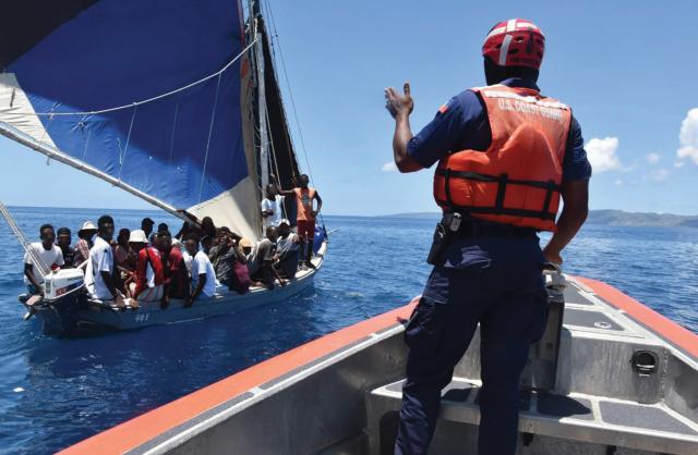 The U.S. Coast Guard works alongside the Haitian Coast Guard to deter migrant vessels at sea. Climate change could force even more migration by sea in the future, which the Coast Guard must consider as it contemplates the missions of the next-generation NSC.