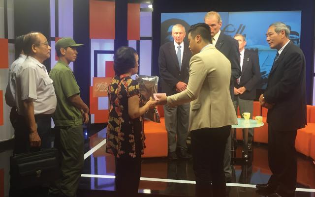After an interview on a Vietnamese TV program, Dosé (third from right) has a poignant meeting with Nguyen Tuyet Hoa, the sister of the North Vietnamese MiG-21 pilot he shot down and killed. A desire for reconciliation and closure prompted the Nguyen family to embrace the Navy pilot. 