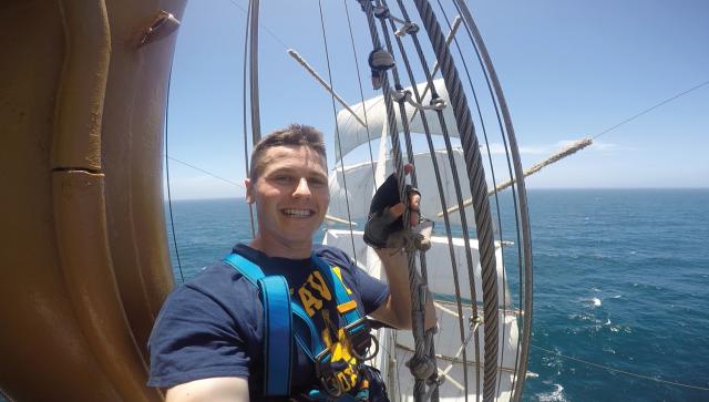 Ensign Andrew Bilden climbing the rigging of the Mexican Navy tall ship Cuauhtémo.