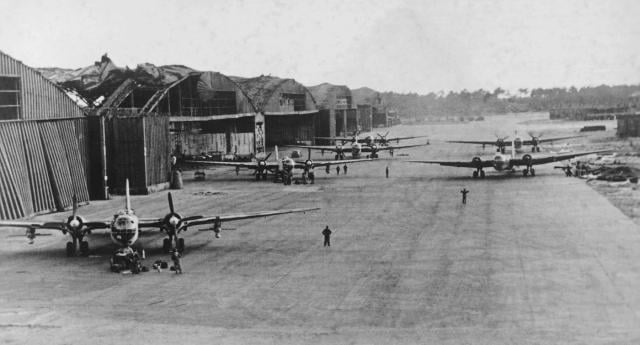 He-177A-3 bombers with Hs 293 glide bombs under each wing, preparing for flight.