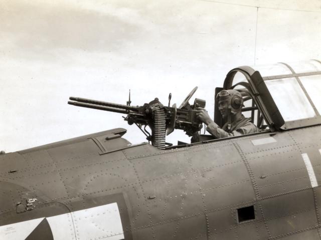 the author “takes aim” with his twin .30-calibers while on the flight deck of the Lexington