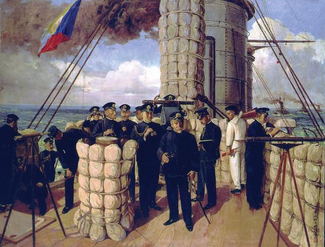 Admiral T-og-o (center) and his officers on the deck of his flagship, the battleship Mikasa, at the commencent of the 1905 Battle of Tsushima. The flag “Z” (left) signals to the fleet: “The fate of the Empire rests on the outcome of this battle. Let each man do his utmost.”