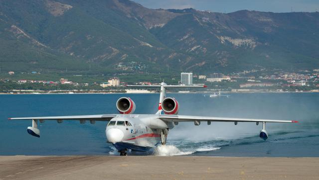 A Russian Beriev Be-200 emerges from the water to return to an airport. A major advantage of amphibious aircraft is their ability to operate from either water or land, giving them mission and geographic flexibility.