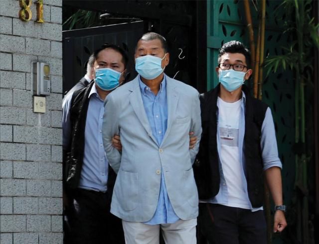 Hong Kong media mogul Jimmy Lai is taken into custody in August 2020. In an act of domestically targeted information warfare, Beijing seized and shuttered Lai’s newspaper, Apple Daily.