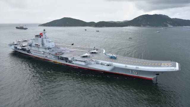 The Liaoning, China’s first aircraft carrier, pictured with J-15 fighters and Z-8 and Z-18 helicopters on the flight deck. 