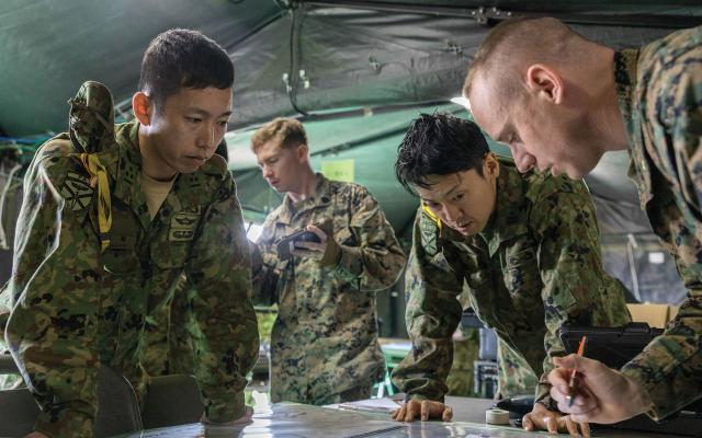 Japan Ground Self-Defense Force service members and a U.S. Marine Corps fire-support coordinator conduct a staff exercise to prepare for collaborative training and operations during Iron Fist 24. 
