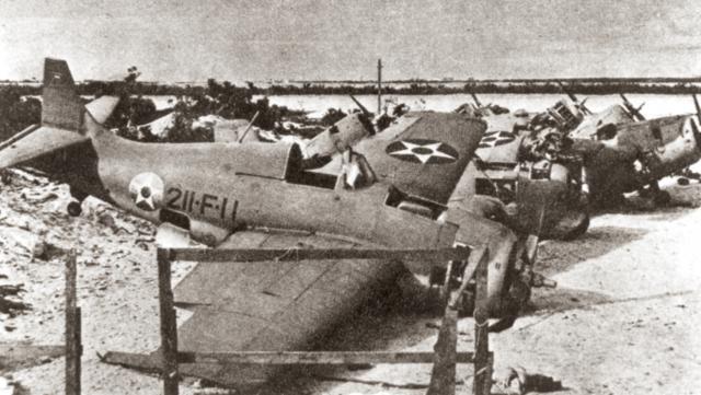 The remains of more than half of the 12 Wildcats that arrived on Wake are visible in this image of VMF-211’s boneyard, where parts would be scavenged from heavily damaged planes to keep other F4Fs flying. The photo was taken shortly after the Japanese captured the island.