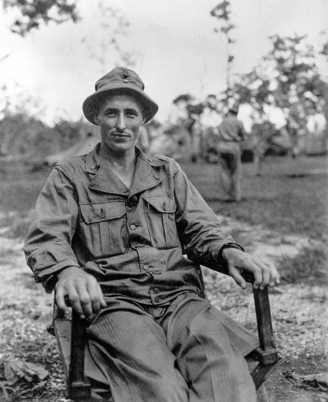 Major Raymond G. Davis sitting in a chair