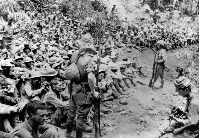 Japanese soldiers guard American prisoners of war on Bataan during the 1941 “death march.” The World War II Philippines campaign saw nearly 100,000 U.S. personnel taken as prisoners of war. During the campaign, the United States had to operate from as far away as Hawaii. 