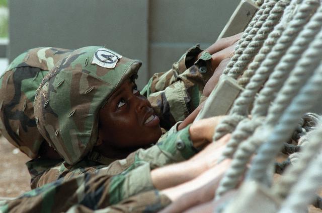 26 December 2001: A U.S. Marine standing watch at a forward operating base in Kandahar, Afghanistan. Marines were among the first ground troops to arrive in Afghanistan in support of Operation Enduring Freedom. 