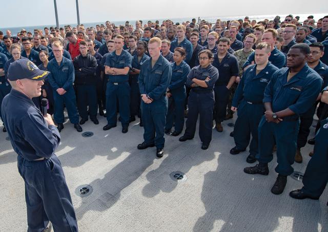 Officers and sailors on board the amphibious dock landing ship USS Fort McHenry (LSD-43) listen to their commanding officer during an all-hands call in the Fifth Fleet area of operations. White naval officers should question why African Americans are significantly underrepresented at the senior ranks.