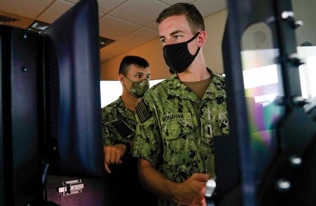 Shore-based submarine trainers today, such as the Submarine Plotting and Navigation Trainer at Naval Submarine Training Center Pacific, include a control room that is configured to mimic a submarine attack center.