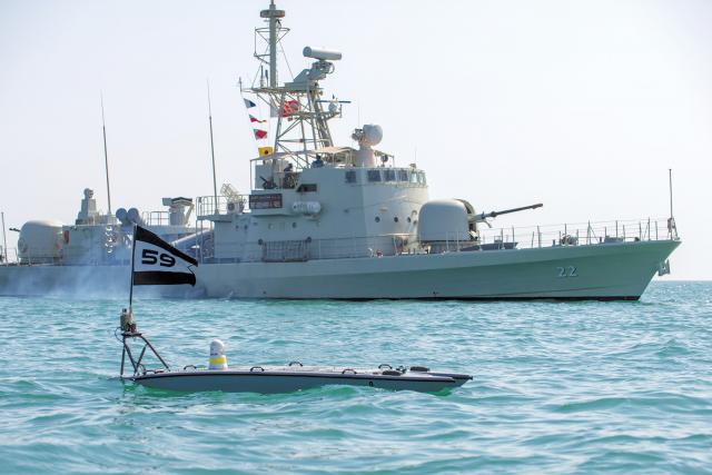 fast-attack craft Abdul Rahman Al-fadel operates alongside a MANTAS T-12 unmanned surface vessel