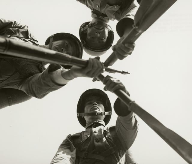 Chinese Nationalist soldiers of the 92nd Division, 2nd Chinese Nationalist Field Army, stack rifles after training near Chiayi, Formosa, under the supervision of the IX Corps Advisor Team, Military Assistance Advisory Group, 2 December 1954.