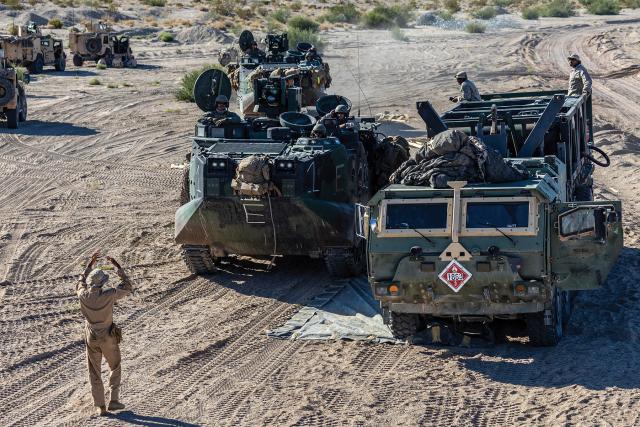 A Marine with 2d Marine Logistics Group guides an Assault Amphibious Vehicle at a mobile fuel station setup during an exercise on Camp Wilson, California, in August 2023. Operational art encompasses the art and science of logistics. 