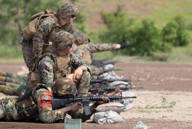 U.S. Marines train with a member of the Ghana armed forces in marksmanship near Daboya, Ghana, during African Lion 23. Headquartering AfriCom in Africa would enhance its ability to support and cooperate with African nations.