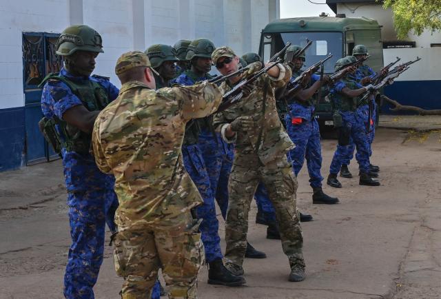 U.S. Coast Guard personnel work with a members of the Gambian Navy in a simulation during Exercise Obangame Express 2019. In addition to these exercises, Gulf of Guinea partner navies should develop extensive language training programs to increase interoperability.