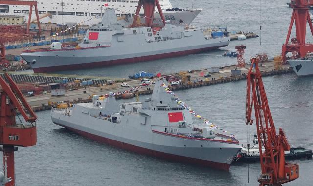 Two Type 055 guided-missile cruisers at China’s Dalian Shipyard.